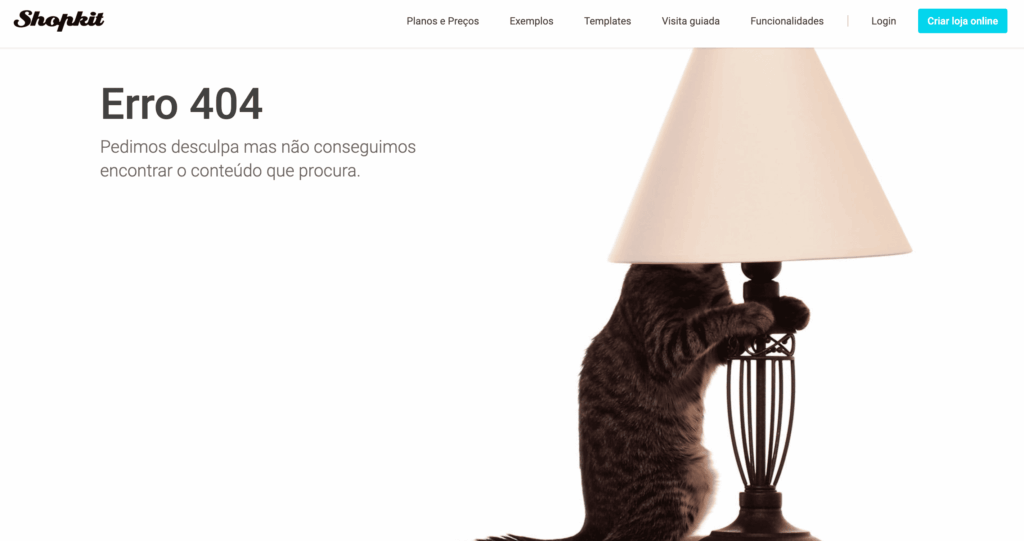 Página de erro 404 da Shopkit, com a mensagem de conteúdo não encontrado e a fotografia de um gato junto a um candeeiro