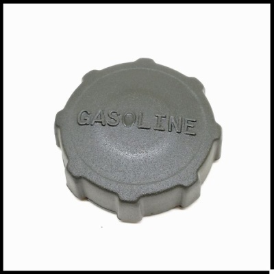 Tampa de depósito de gasolina cinzenta com a palavra GASOLINE