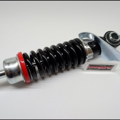 amortecedor de suspensão com mola preta e partes metálicas