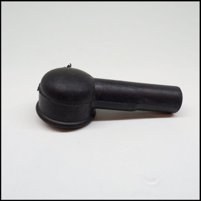 Peça de borracha preta cilíndrica com extremidade arredondada