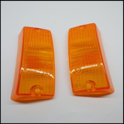 Tampas de luzes automotivas laranja em plástico transparente com textura quadriculada