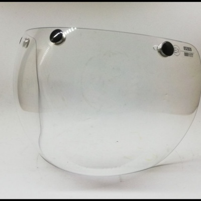 Visor transparente para capacete com fixadores pretos e texto 'VISION SM VENT'