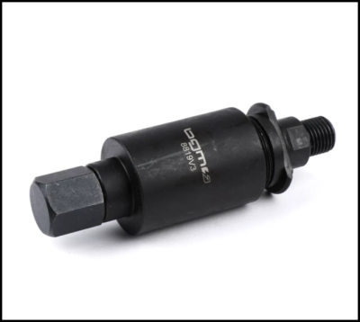 Peça mecânica preta cilíndrica com rosca e porca hexagonal