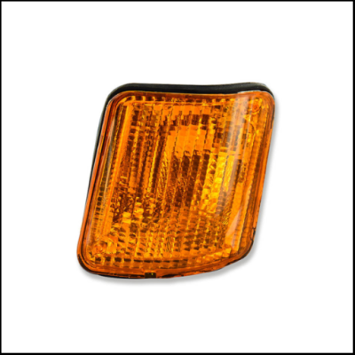 Luz ou indicador automóvel laranja com textura facetada e moldura preta