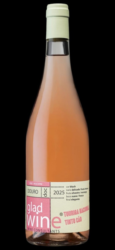 Garrafa de vinho rosé com rótulo creme e rosa sobre fundo negro