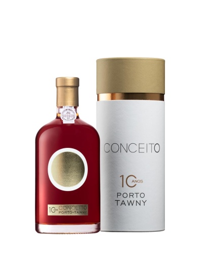Garrafa de luxo de Porto Tawny ao lado da sua embalagem cilíndrica branca e dourada