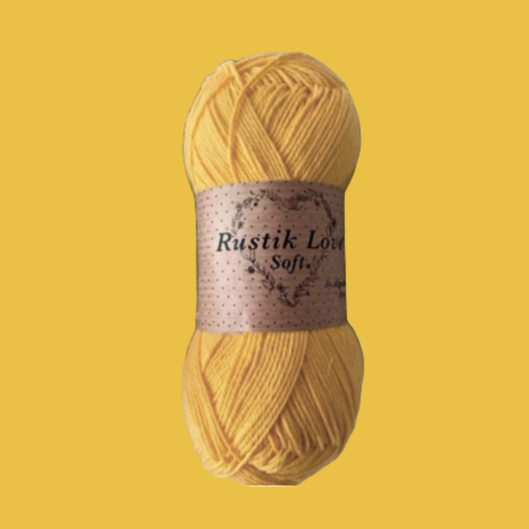 Novelo de lã amarelo com etiqueta 'Rustik Love Soft'