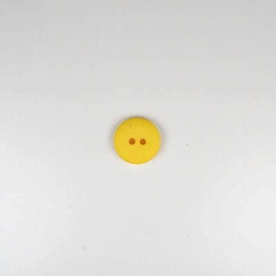 Botão redondo amarelo com dois orifícios centrais