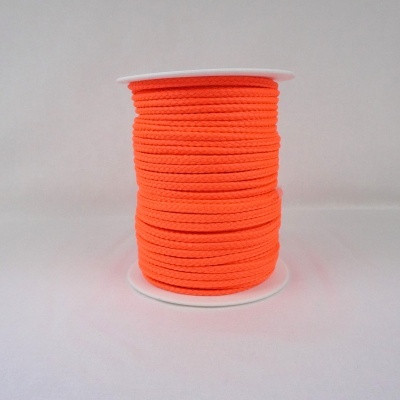 Rolo de corda laranja fluorescente num carretel branco