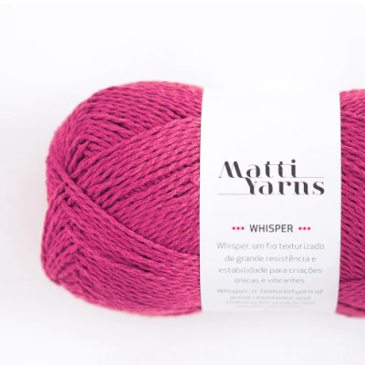 Skein of magenta yarn 'Whisper' from Matti Yarns on white background