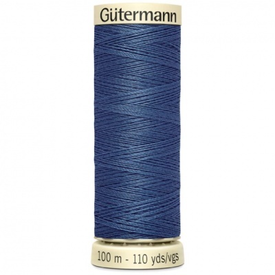 Spool of dark blue sewing thread labeled Gütermann