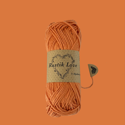 Novelo de fio de algodão laranja com etiqueta rustik