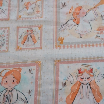 Tecido estampado com desenhos de anjos em quadrados coloridos