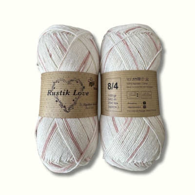 Novelo de fio de algodão Rustik Love creme com riscas vermelhas e etiqueta castanha