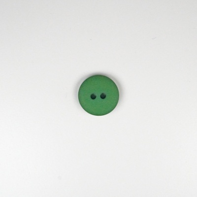 Botão verde redondo com dois buracos