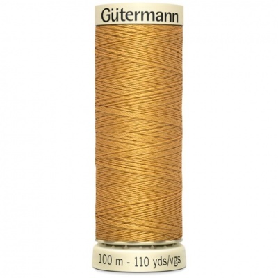 Spool of orange-brown Gütermann sewing thread with brand and length labels