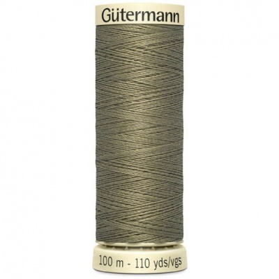 Spool de linha Gütermann cinza com rótulos com texto