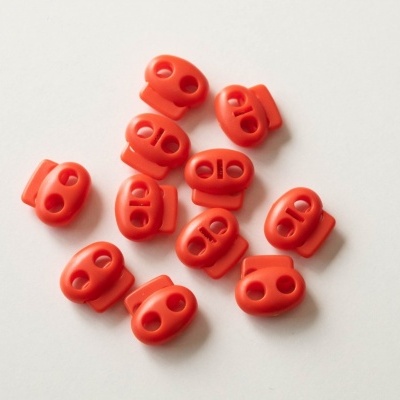 Bloqueadores de cordão laranja com dois orifícios