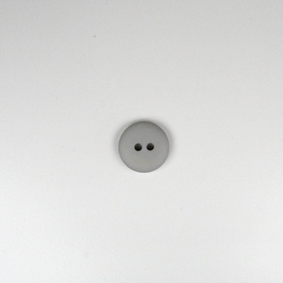 Botão cinzento redondo com dois furos em fundo branco