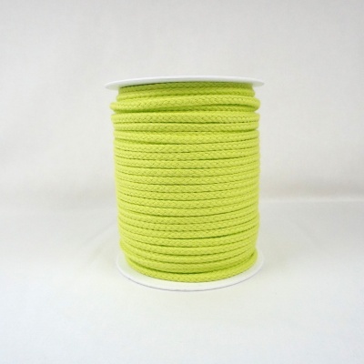Rolo de cordão verde fluorescente em carretel branco.