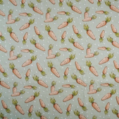 Tecido cinzento com padrão de cenouras e folhas verdes