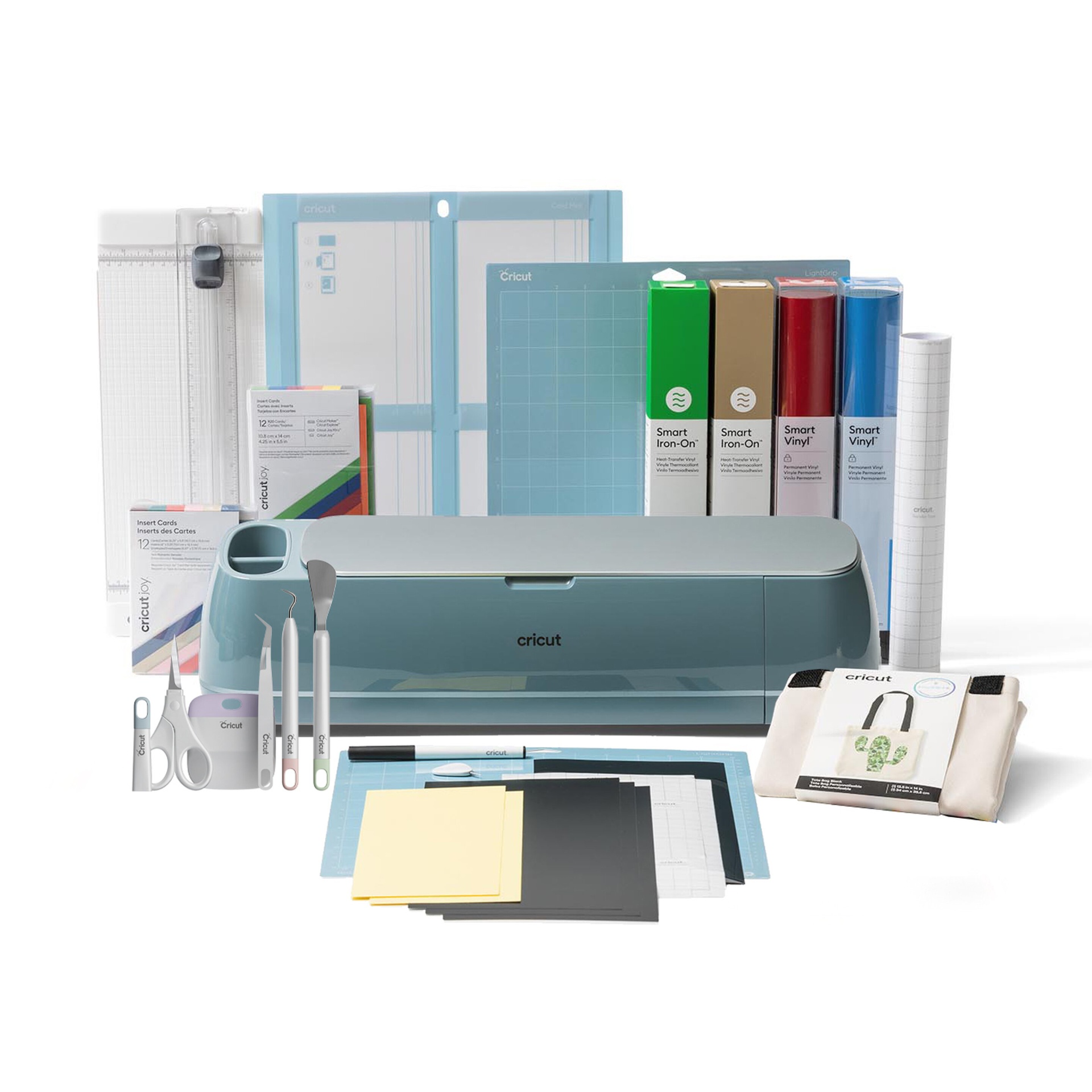 Máquina de corte Cricut azul claro com acessórios, folhas e vinil colorido