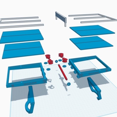 Peças azuis e vermelhas para montagem sobre fundo branco com grelha.