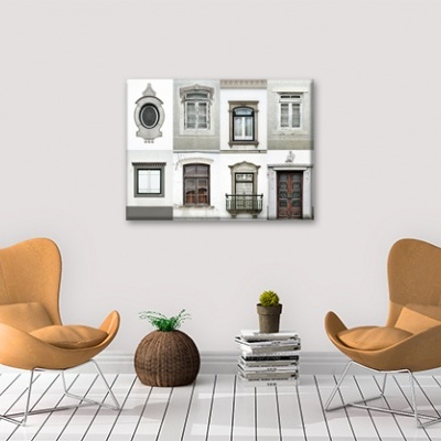 Sala minimalista com poltronas laranja, vaso, livros, cacto e quadro com janelas.