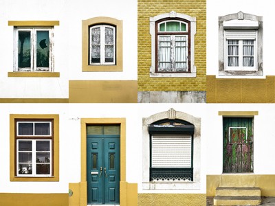 Parede com sete janelas e uma porta de estilos variados, em branco, amarelo, verde e madeira.