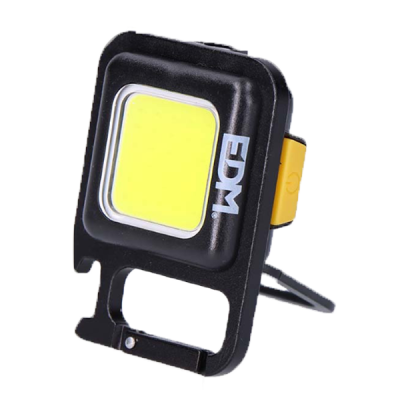 Projetor LED compacto preto com luz amarela e suporte