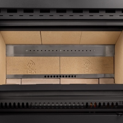 Interior de recipiente metálico cinzento com forro amarelo e inscrição TEK