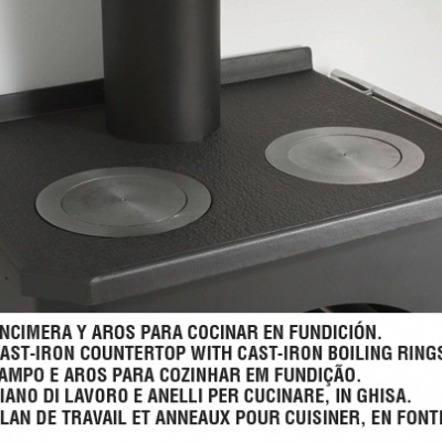 Placa de cozinha em ferro fundido preto com duas superfícies circulares removíveis e texto descritivo em várias línguas