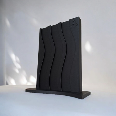 Espaçador preto para cápsulas de café com design ondulado e ícone de chávena