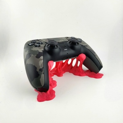 Comando de videojogo camuflado em silicone vermelho elástico