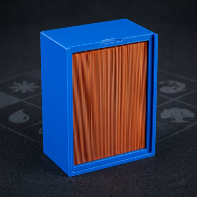 Caixa azul com folhas cor de laranja em fundo preto com padrões cinzentos