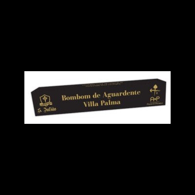 Embalagem preta de bombom com texto dourado e logos