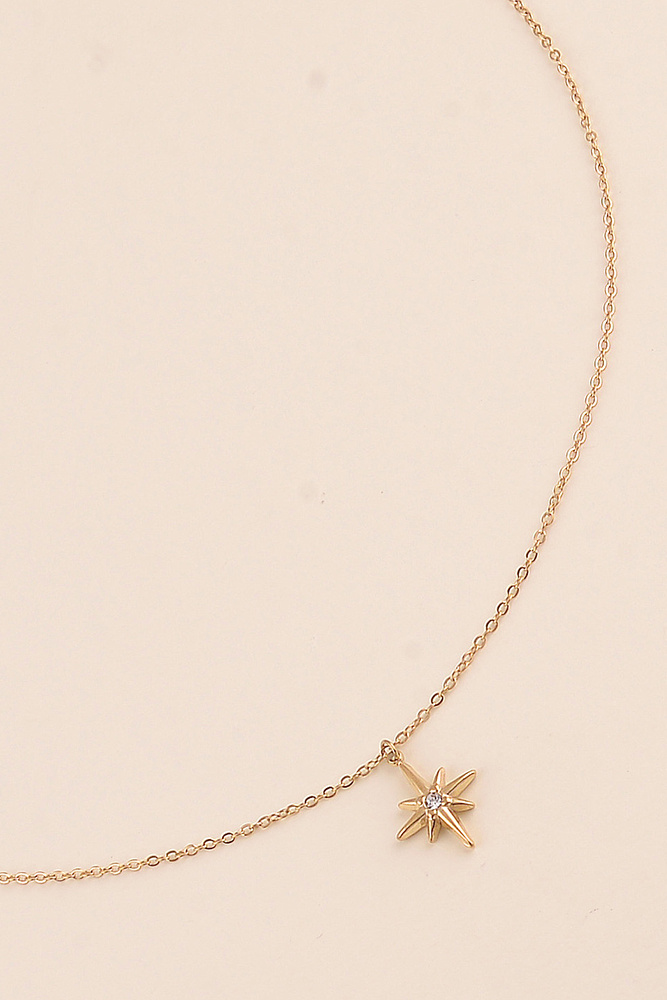FIO ESTRELINHA Colar dourado com pingente de estrela de oito pontas e cristal