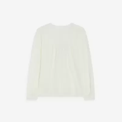 Blusa branca de manga comprida com detalhes bordados