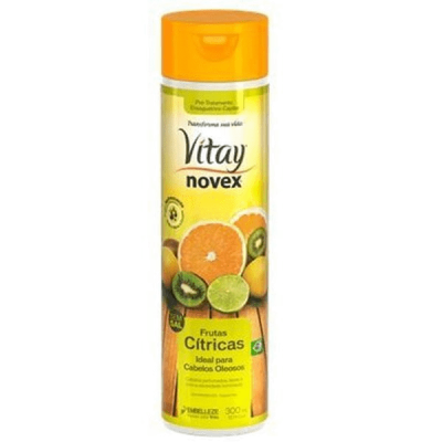 Frasco de shampoo amarelo Novex com frutas cítricas e tampa laranja