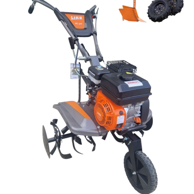 Motoenxada LIKE ML 500 com motor laranja e preto, incluindo arado e rodas adicionais
