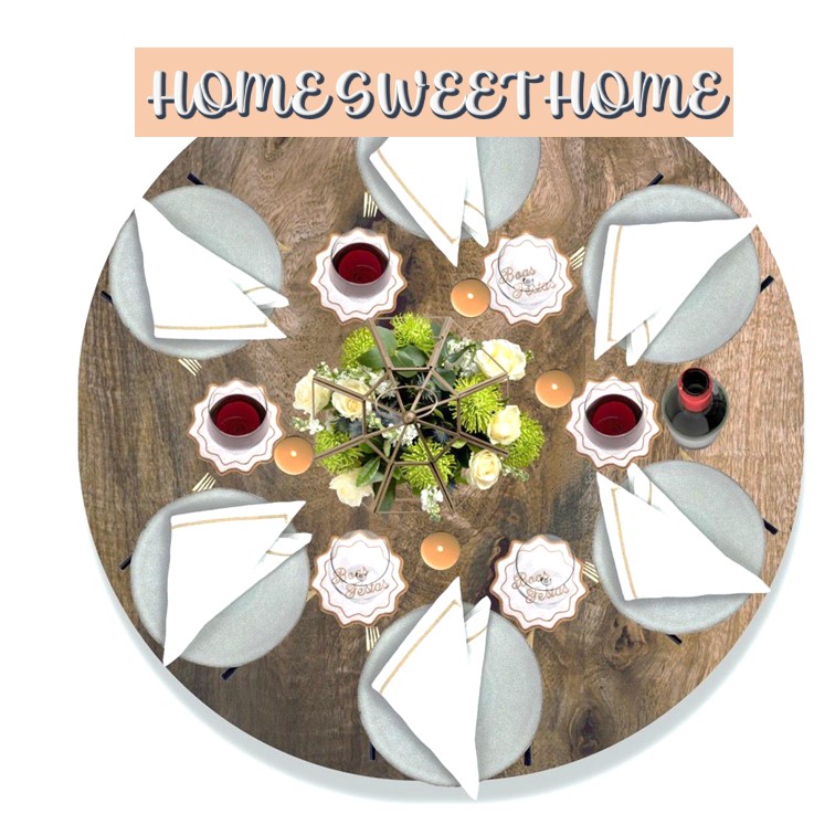 Mesa redonda de madeira com pratos cinzentos, guardanapos brancos e centro decorativo de flores