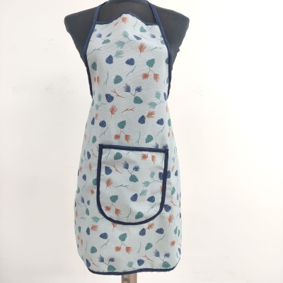 Avental com padrão de folhas coloridas em tecido cinza claro e bordas azul escuras