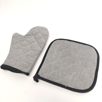 luva e suporte para panelas cinzentos com padrão de losangos