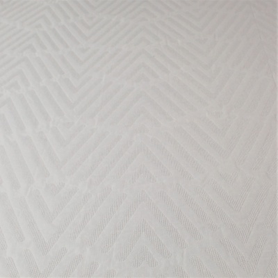 tecido branco com padrão geométrico em relevo