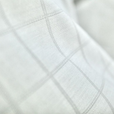 Tecido branco com padrão quadriculado cinza claro em close-up