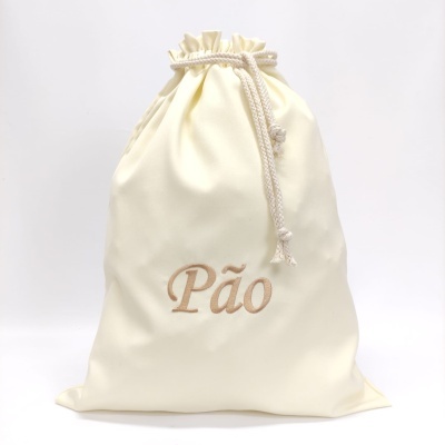 Saco de tecido creme com cordão e palavra bordada Pão