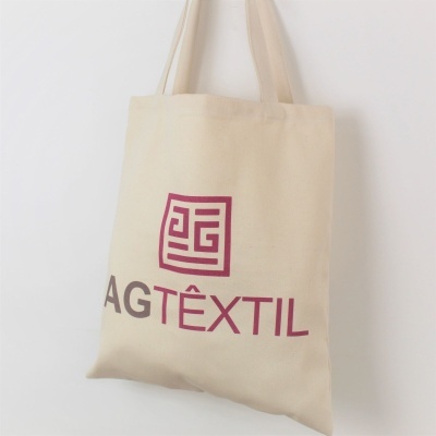 Saco de tecido bege com logótipo AGTÊXTIL impresso