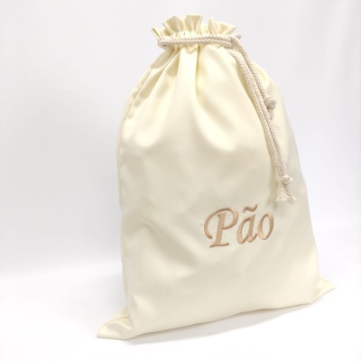 Saco creme para pão com cordão e bordado