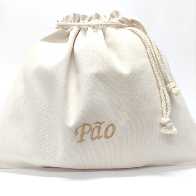 Saco de algodão cru com cordão e palavra Pão bordada