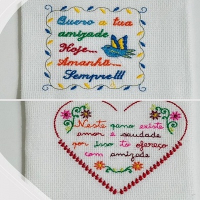 bordados coloridos em tecido branco com textos e desenhos